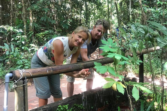 Ben Duoc - Authentic Cu Chi Tunnels Private Tour - Entering Ben Duoc: Camouflaged Entrances, Bamboo Traps, and Forest Shade