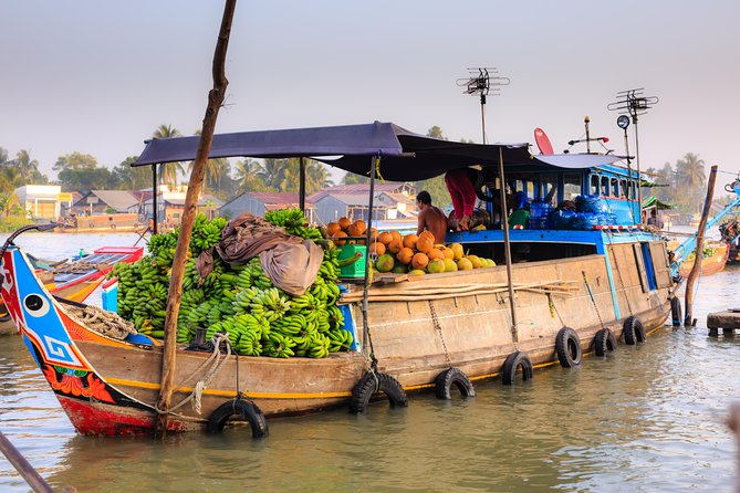 Full-Day Mekong Delta Tour - Rowing sampan into smaller canals: where the delta gets personal