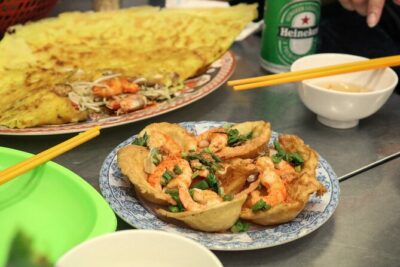 Private Local Food 4-hour Scooter Tour in Ho Chi Minh City - Getting on in District 1: Bitexco meeting point and the ride setup