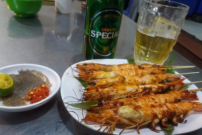 Saigon After Dark and Street Food by Motorbike and Scooter - District 4: The Food Paradise and Immigrant Stories in One Ride